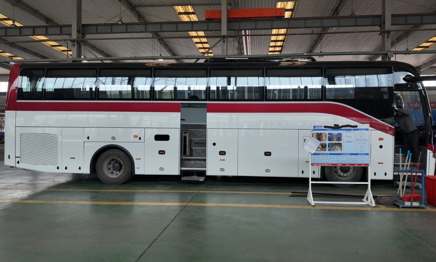 Finished coach side profile on assembly line with open door