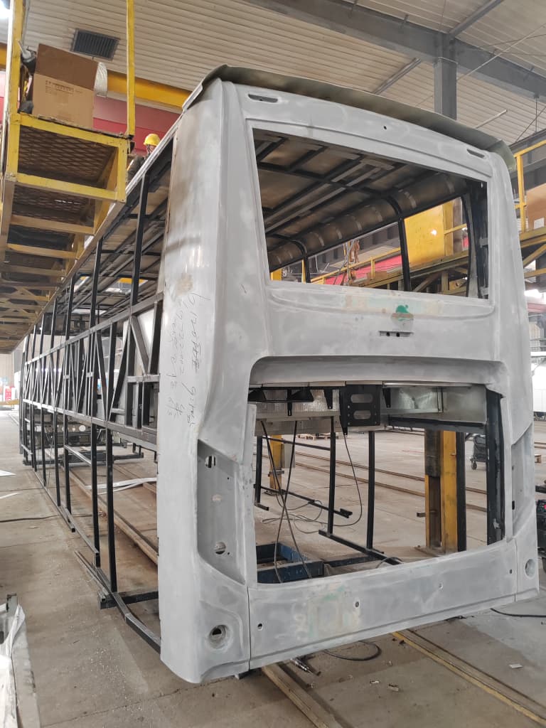 Body-in-white rear shell with frame exposed during assembly